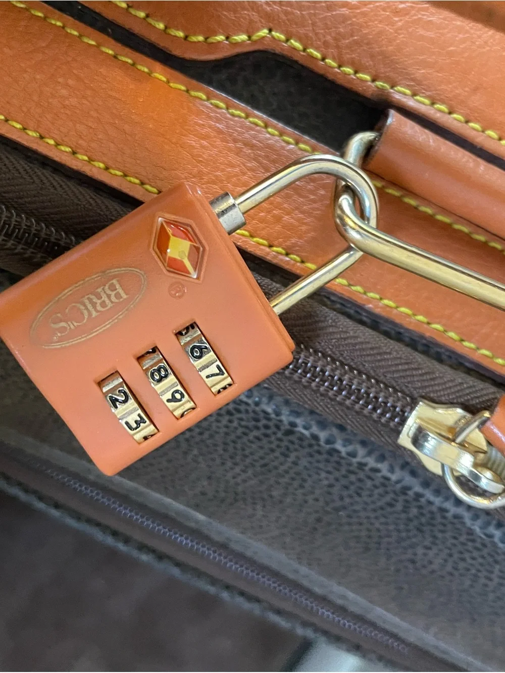 Bric's Dark Brown and Orange Carry-On Suitcase